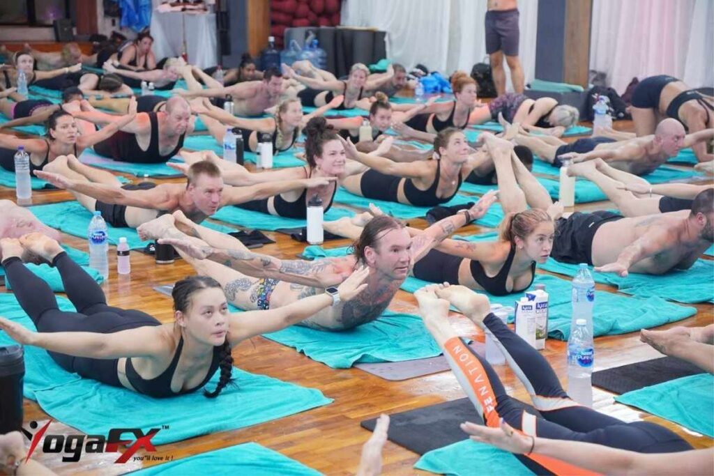 Bikram yoga for lower back pain showing floor series Full Locust and Half Tortoise postures posterior chain strengthening at YogaFX Bali