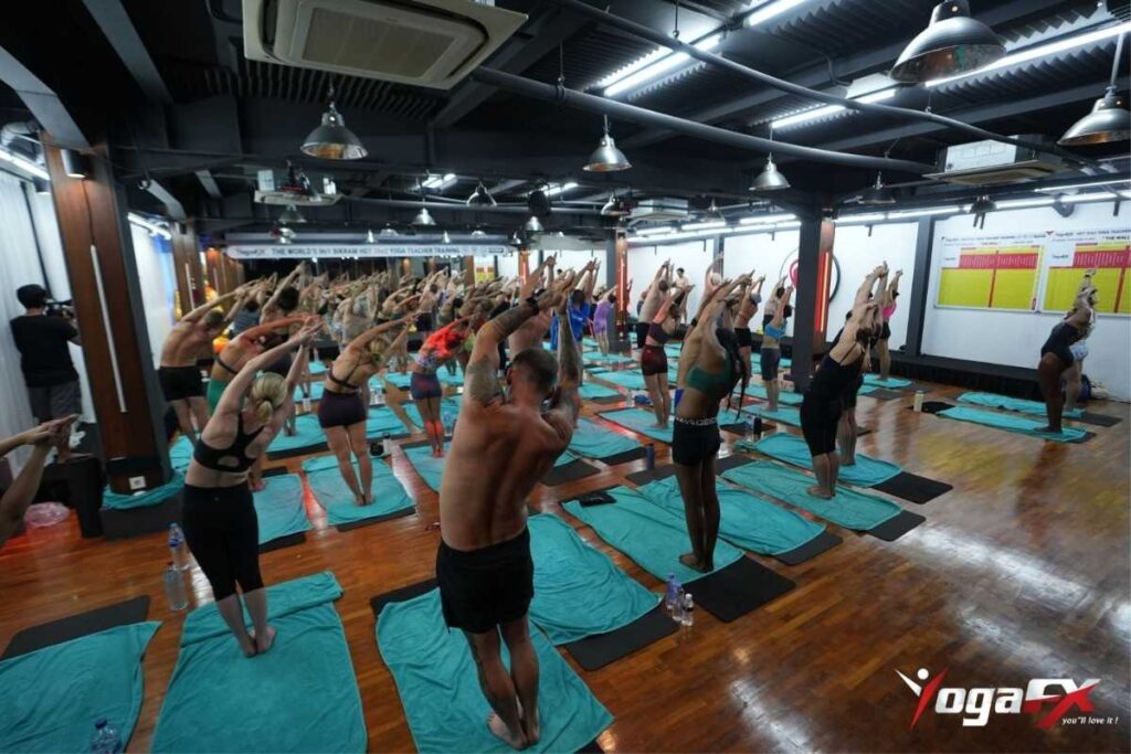 Bikram yoga scoliosis heat therapy 40 degree environment relaxing asymmetric paraspinal muscle tension before posture work begins