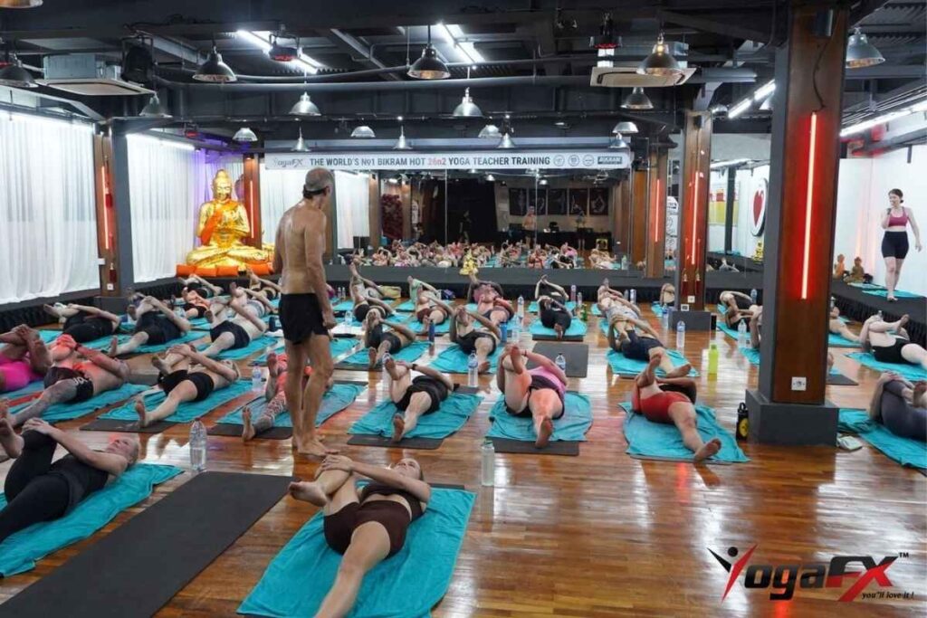 How to become a Bikram yoga teacher 2026 showing YogaFX Bali RYT 200 Bikram certification and ACE triple credential pathway