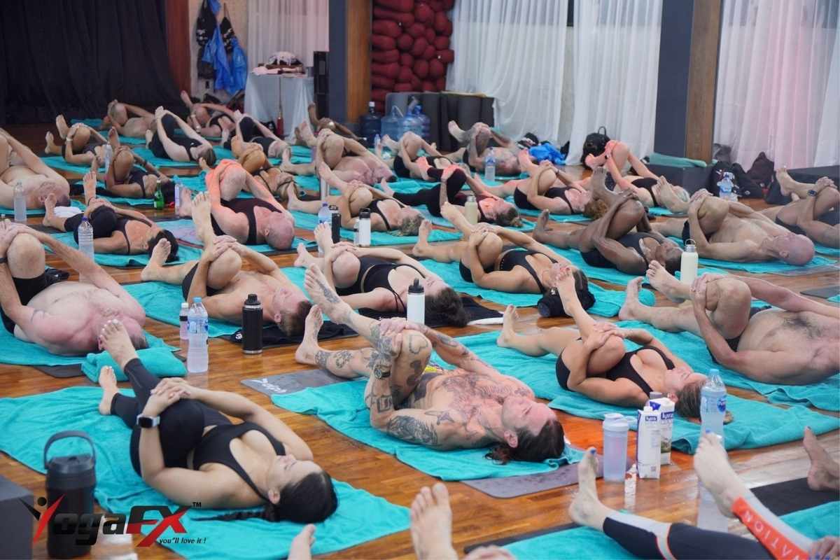 Yoga retreat Bali Indonesia at YogaFX studio showing practitioners in Bikram 26 and 2 class in natural tropical heat Seminyak