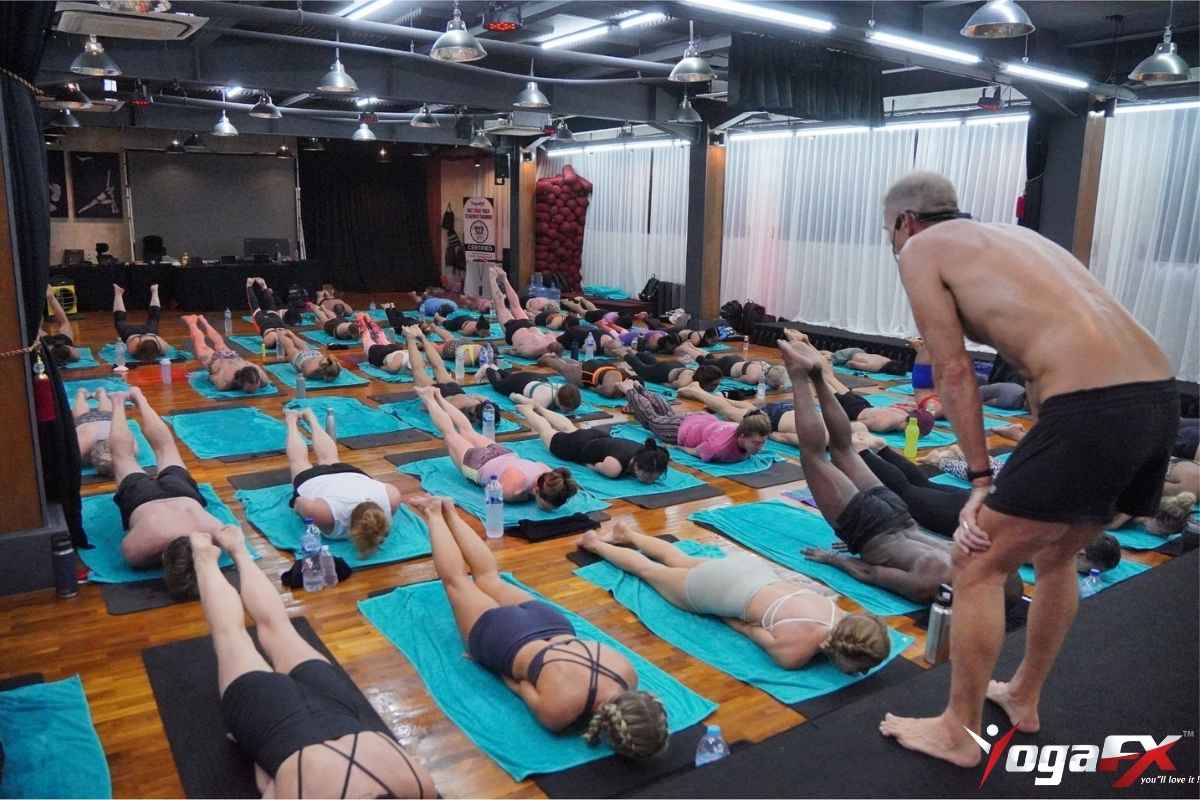 Yoga teacher training intensive session in Bali at YogaFX studio with students practicing Bikram 26&2 in natural tropical heat