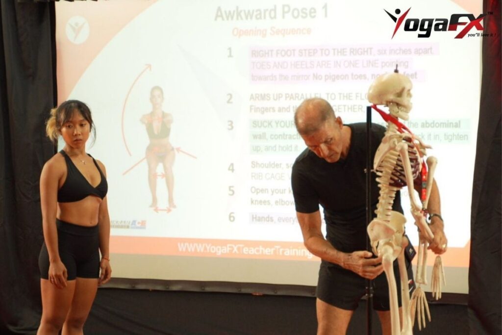 Corrected shoulder alignment in plank pose to prevent upper back pain from collapsed shoulders in yoga