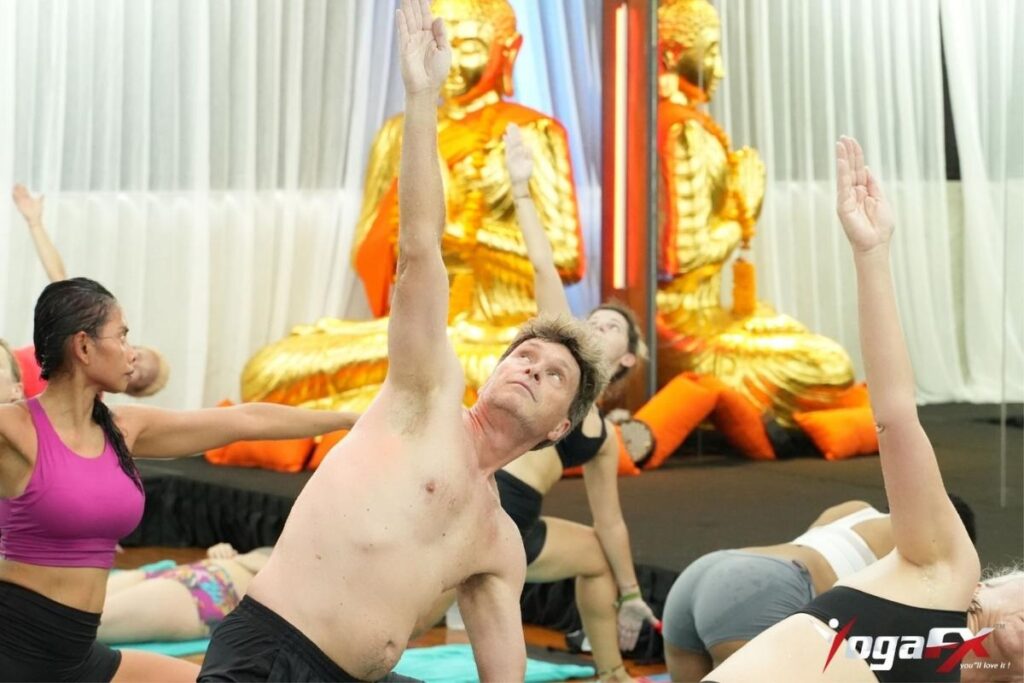 Yoga teacher trainee completing supervised practicum hours required for the RYT 500 certification under Yoga Alliance advanced 300-hour curriculum.
