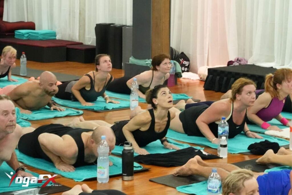 Thread the needle yoga pose to stretch the rotator cuff and ease swimmer's shoulder pain