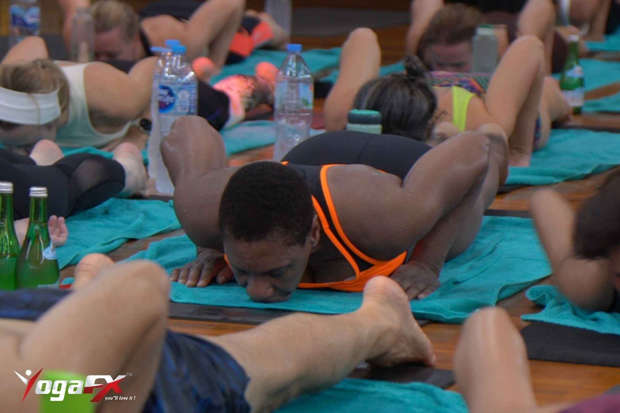 Yoga student talking with instructor after class for support