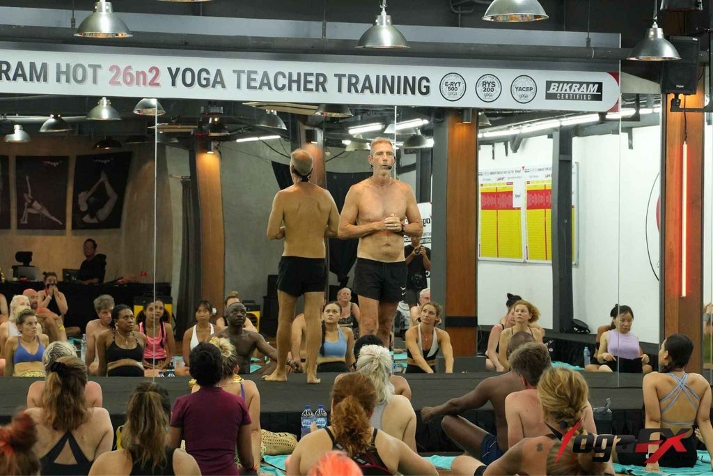Mr. Ian Terry, E-RYT 500, correcting dialogue delivery during a Bikram yoga teacher training posture clinic at YogaFX Seminyak, Bali
