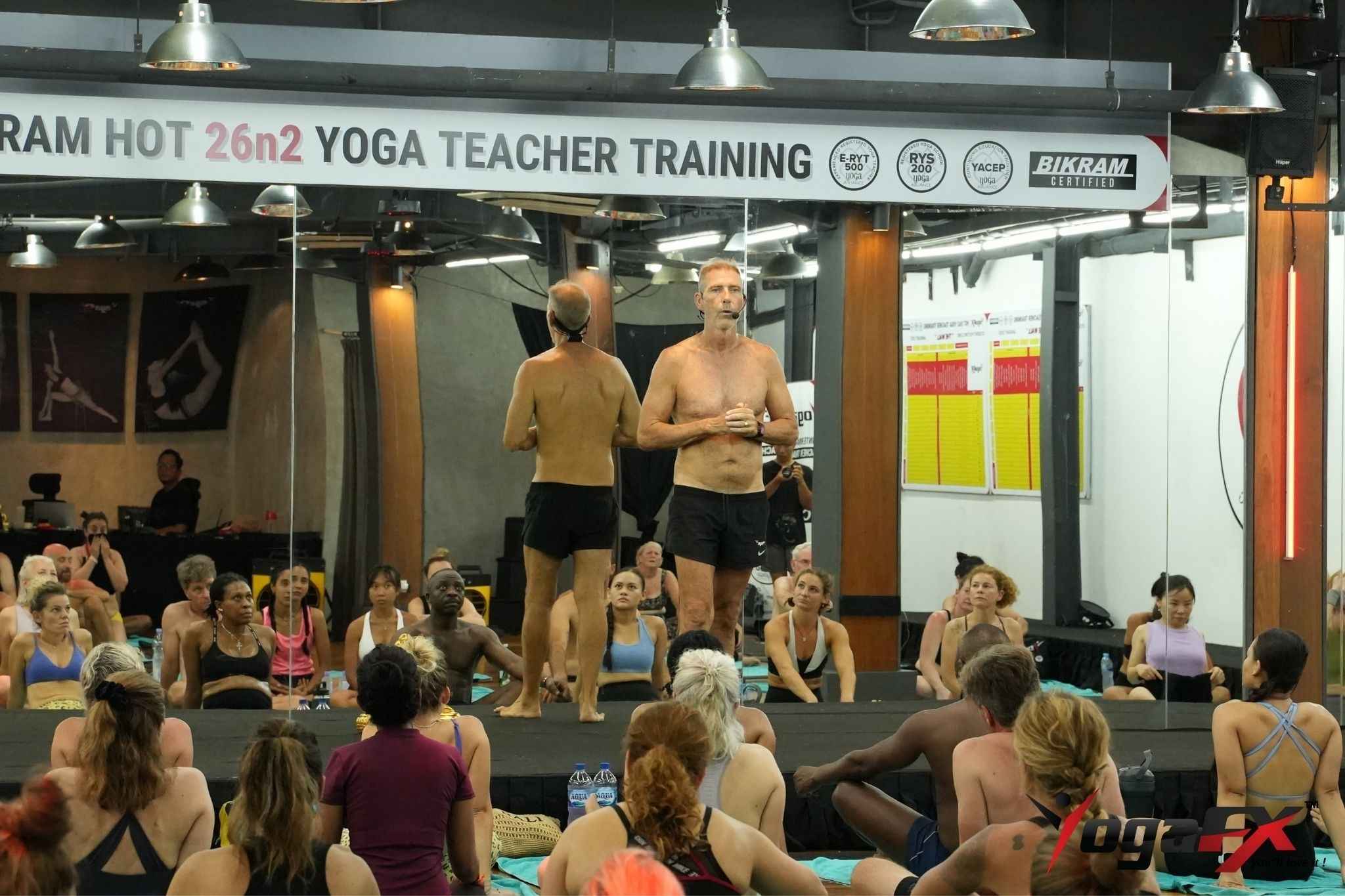 Mr. Ian Terry coaching a Bikram yoga teacher trainee through the 26&2 dialogue during a clinic in Bali