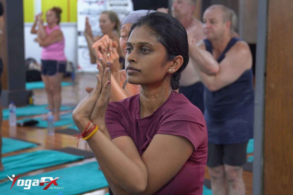 Yoga teacher leading a private one-on-one client session